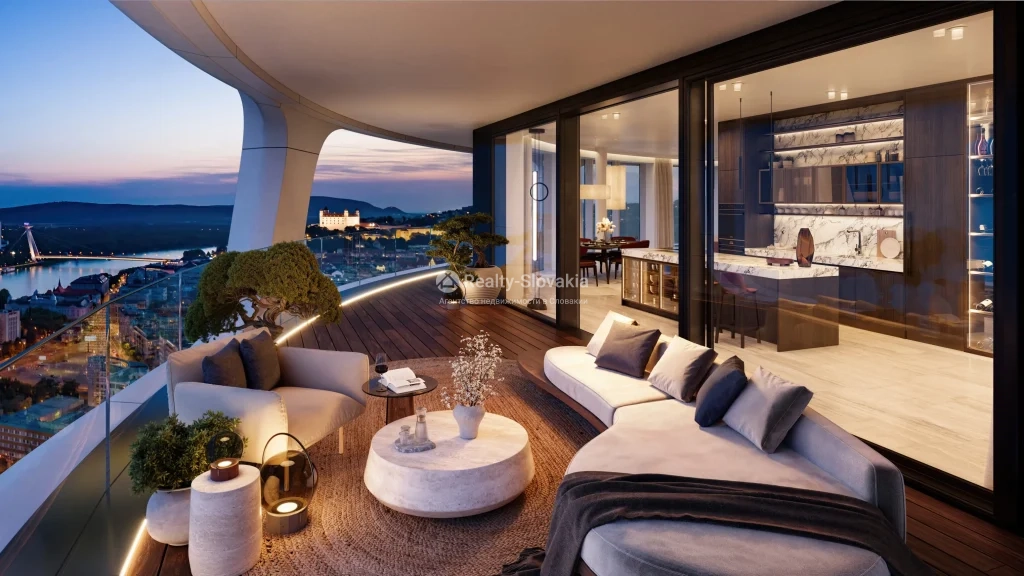 Проект Sky Park Tower: Вечерняя терраса с мягкой мебелью и подсвеченной кухней